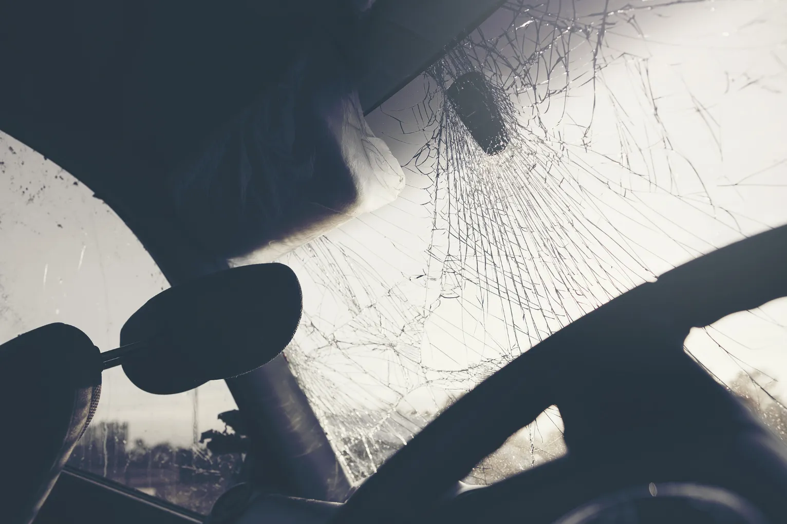Broken windshield after a car accident. If you've been injured by a negligent driver, our car accident lawyers in Kansas City can help you.
