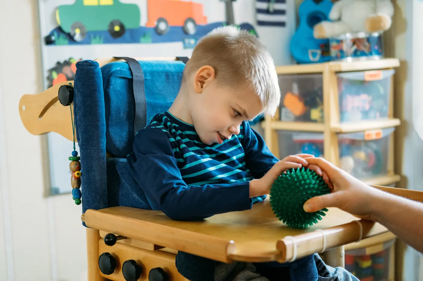 Little boy with cerebral palsy in a special chair at school. Our Kansas City lawyers can help if your child has been diagnosed with cerebral palsy due to a birth injury.
