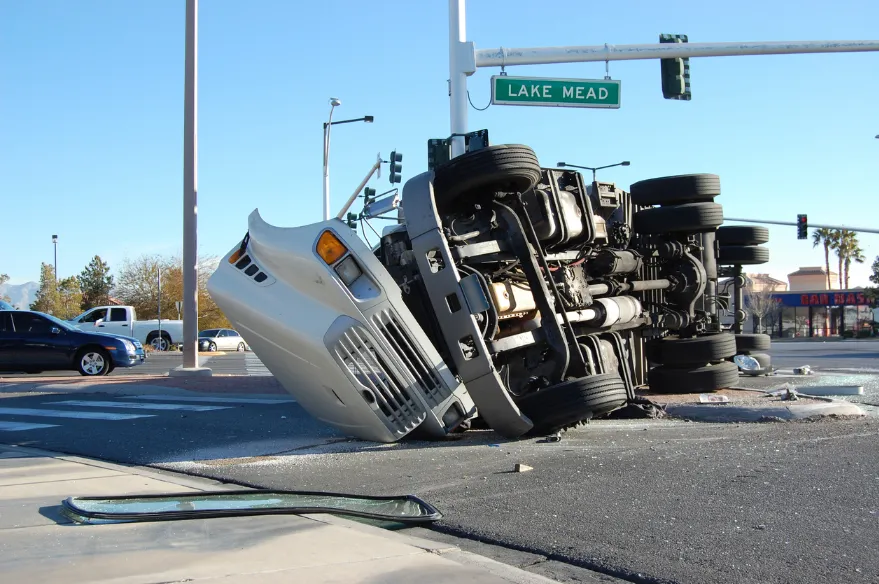 Commercial truck tipped on its side in the middle of an intersection. Our Kansas City truck accident lawyers defense those injured by semi trucks and big rigs.