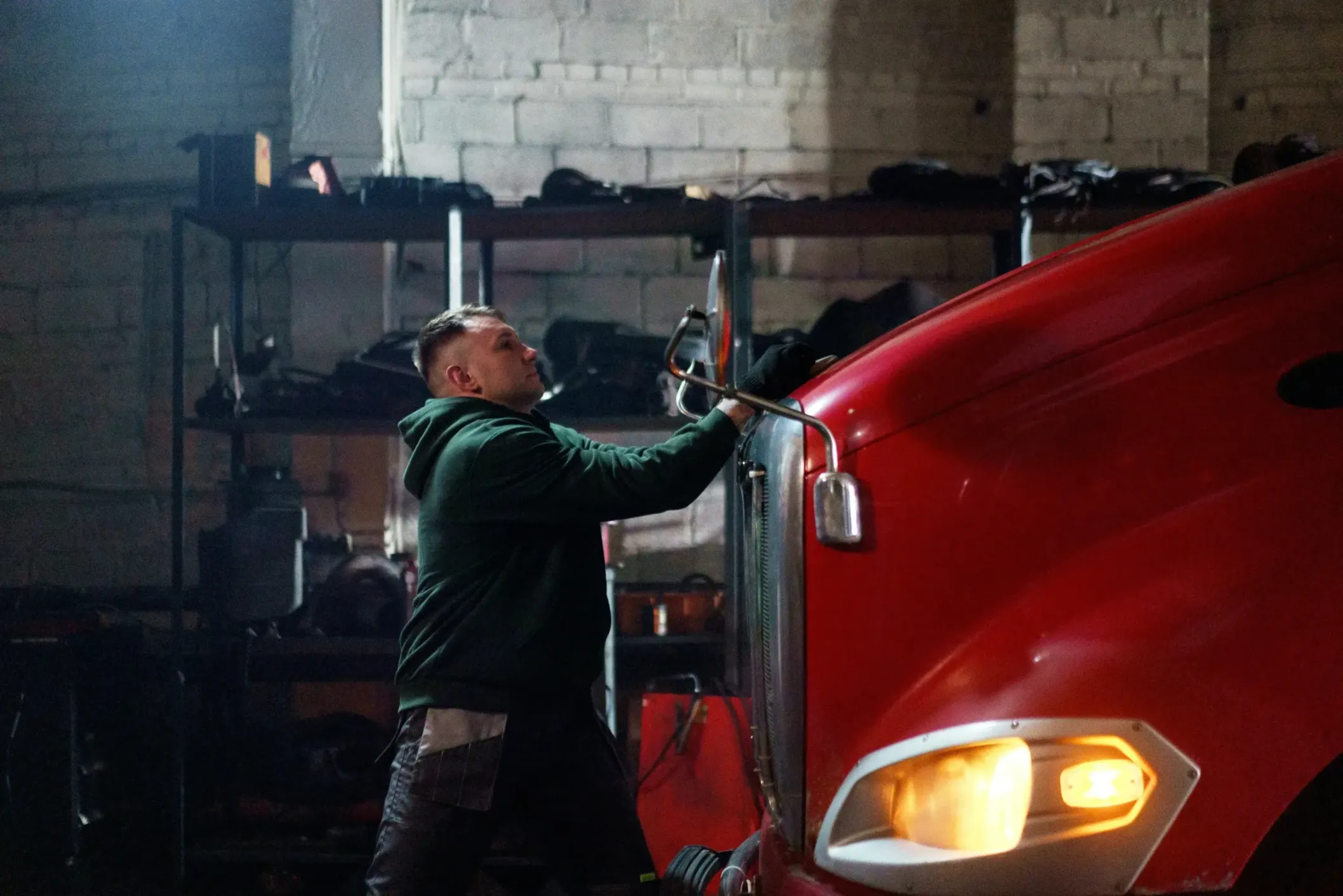 A mechanic working on a commercial truck.