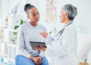 A doctor going over results with a patient.