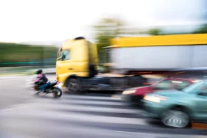 A motorcycle speeding through traffic. 