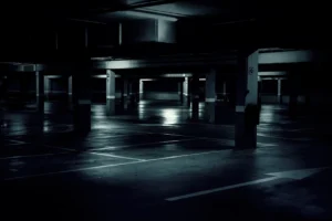 A dark, poorly-lit parking garage.