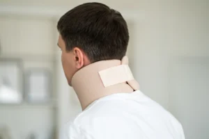 A person with a neck brace.